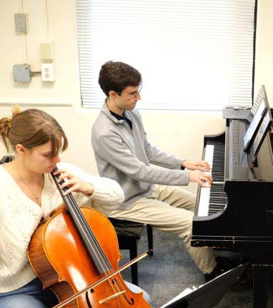 Students playing the chelo and piano